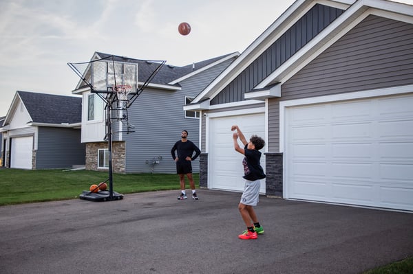 Kid Shooting Basketball with Father